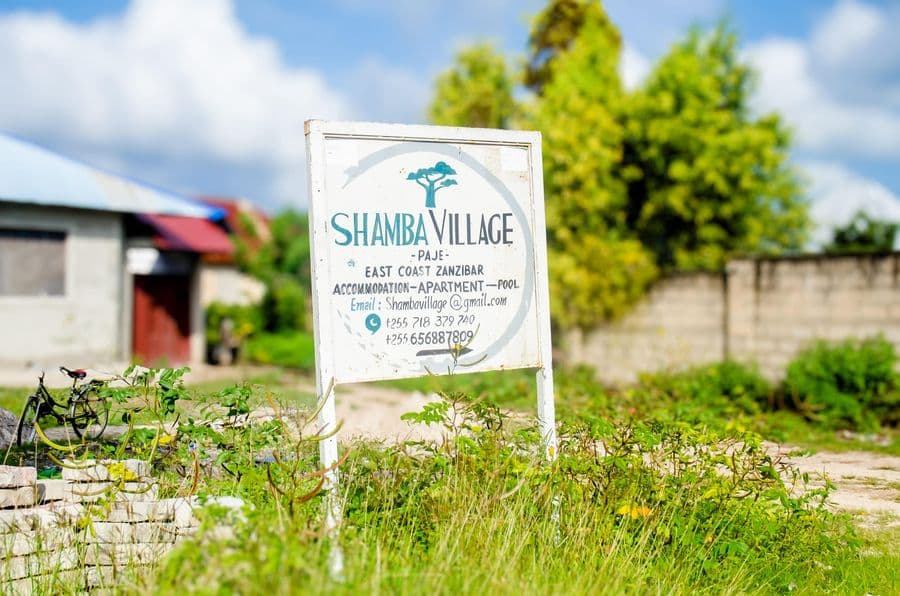 The Shamba Village sign at the entrance